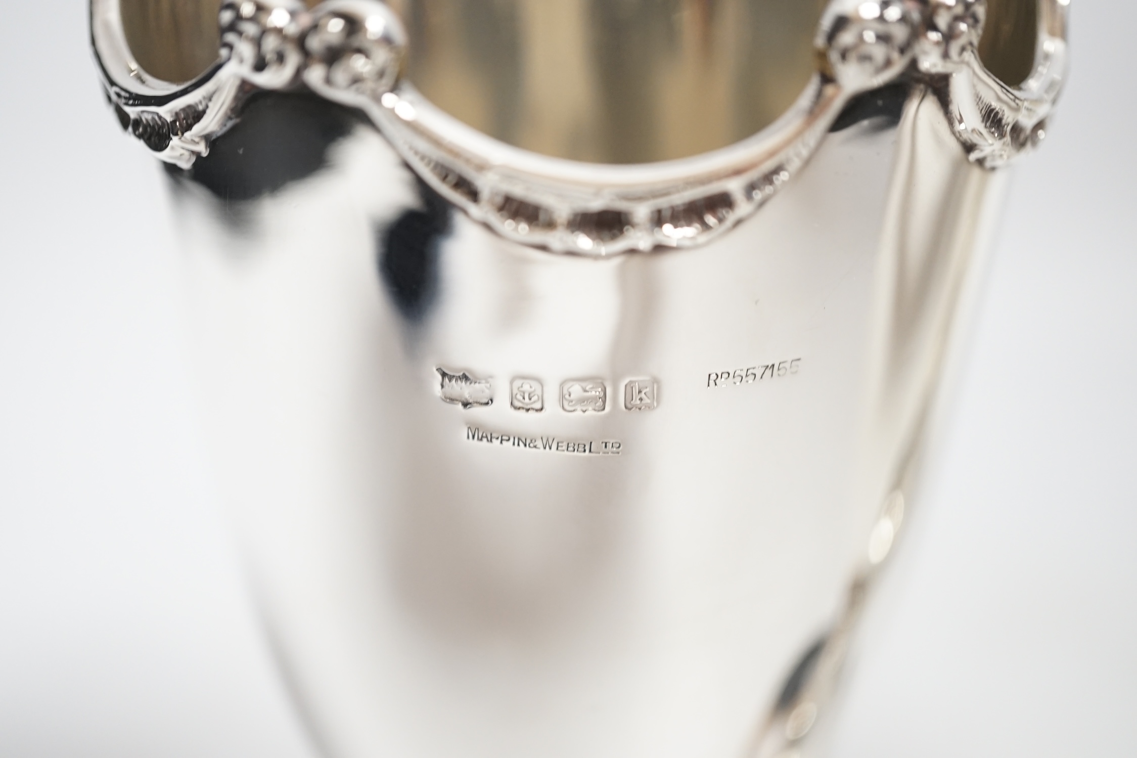 A pair of Edwardian silver pedestal vases, by Mappin & Webb, Birmingham, 1909, 17.1cm, 13.7oz.